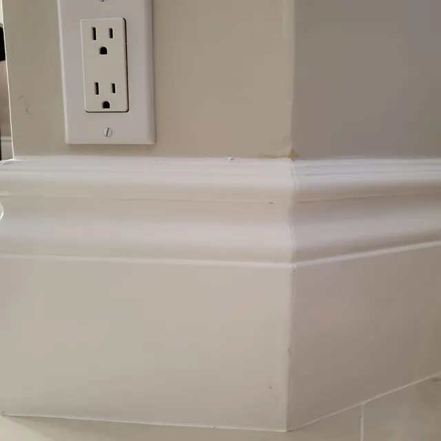 New baseboard and outlet trim detail