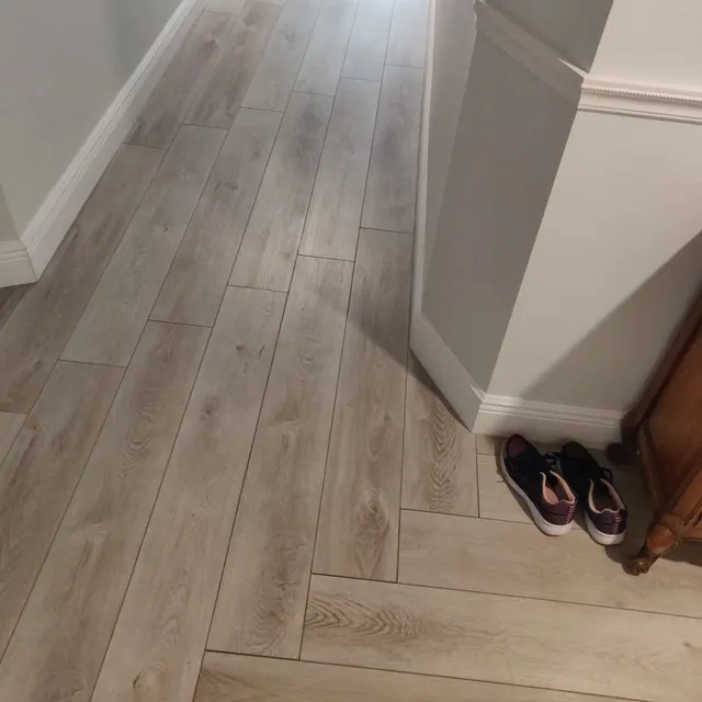Plank flooring with new baseboards