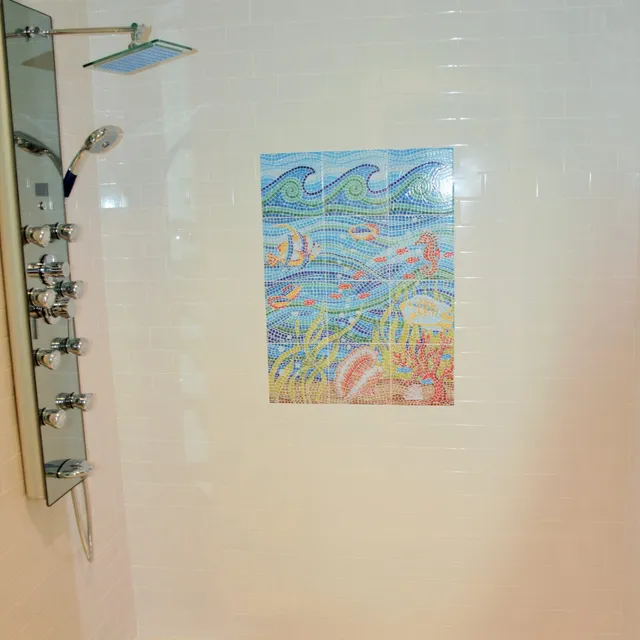 Shower panel and ocean-themed tile mural