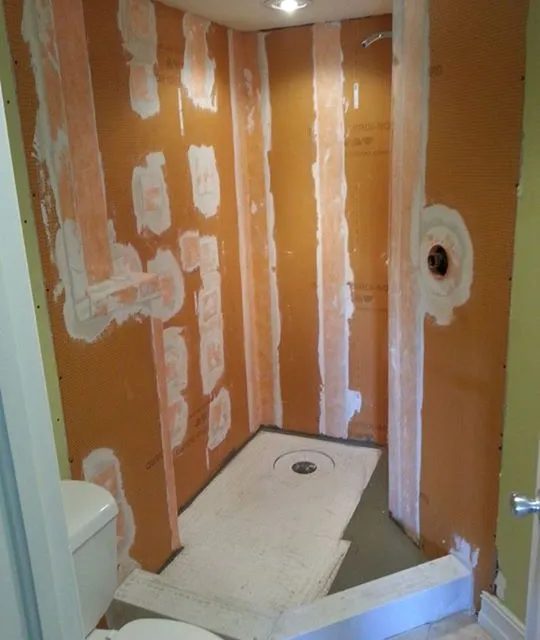 Shower in progress: walls waterproofed and ready for tile